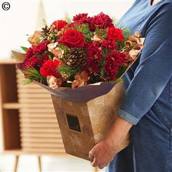 Christmas hand tied bouquet in  reds